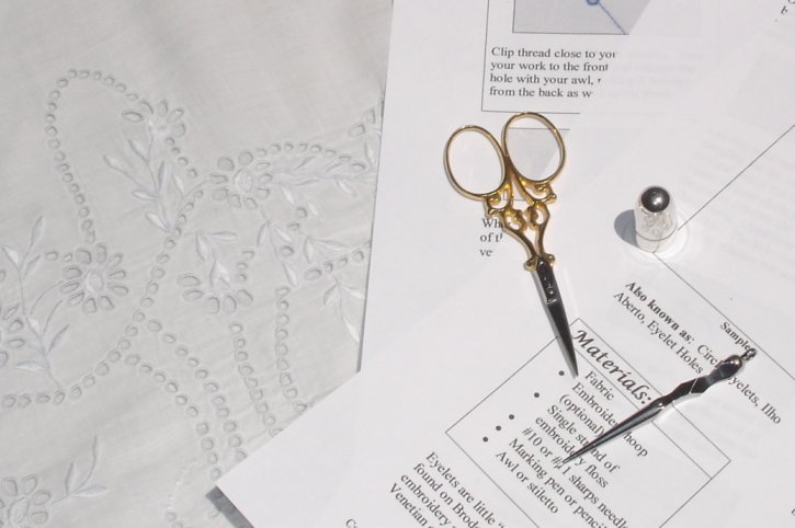 Basic eyelets instructions, example of eyelets on fabric, scissors and awl